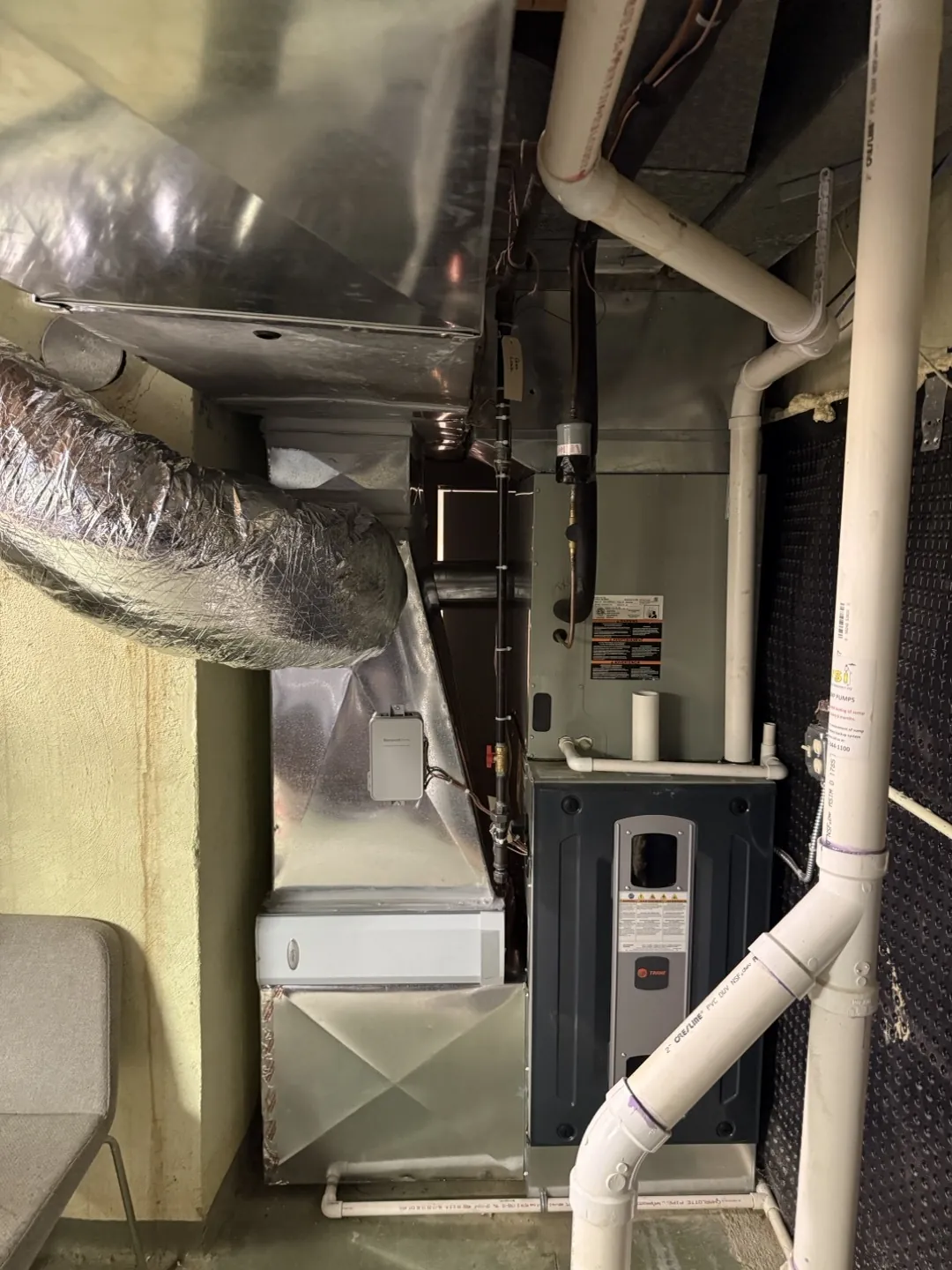 The air handler after the new fitting was installed by the furnace and filter.