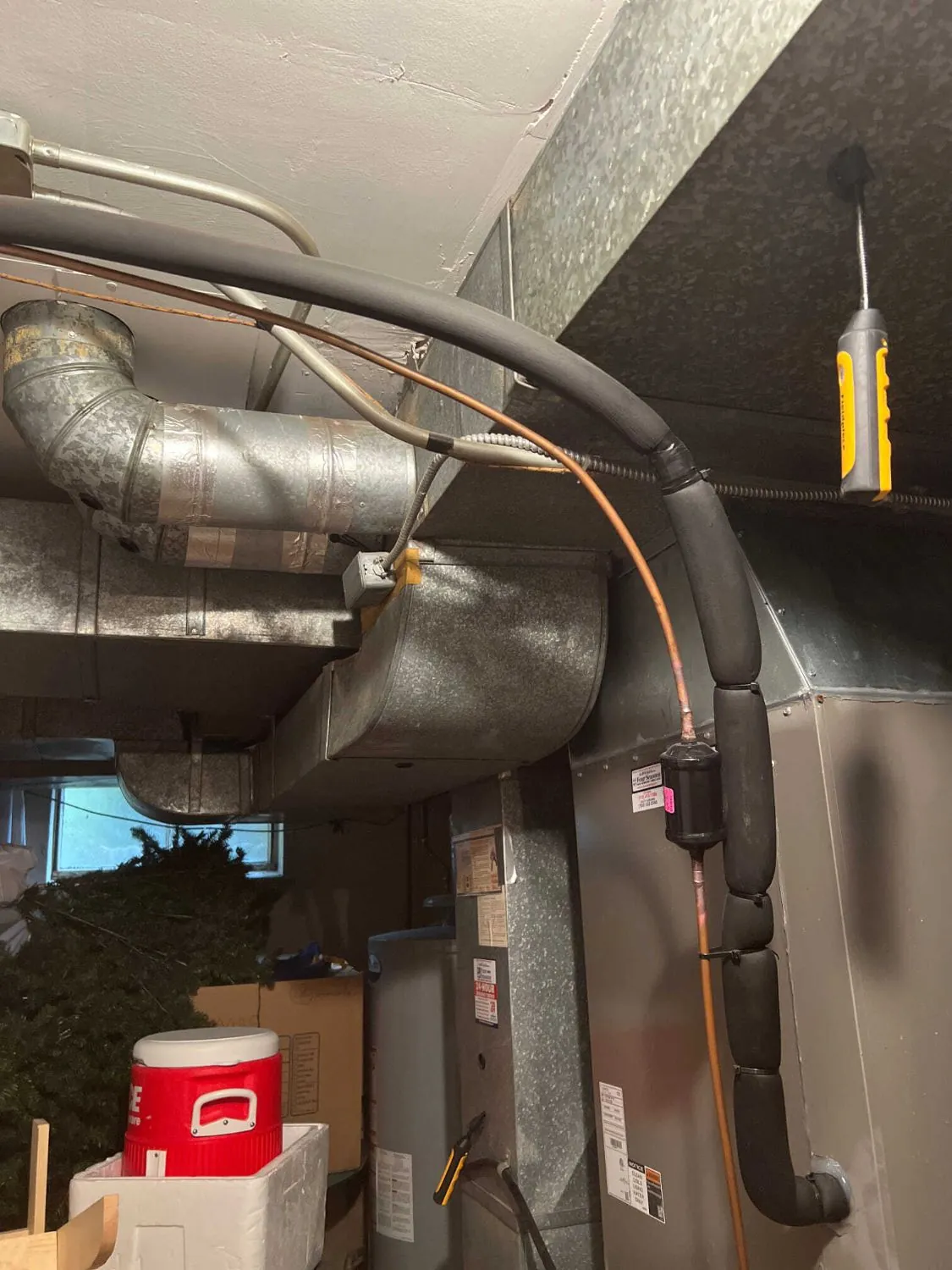 The original lineset and supply ductwork before the work.