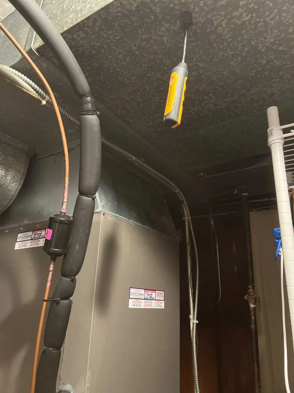 The restrictive original fittings above the air handler.