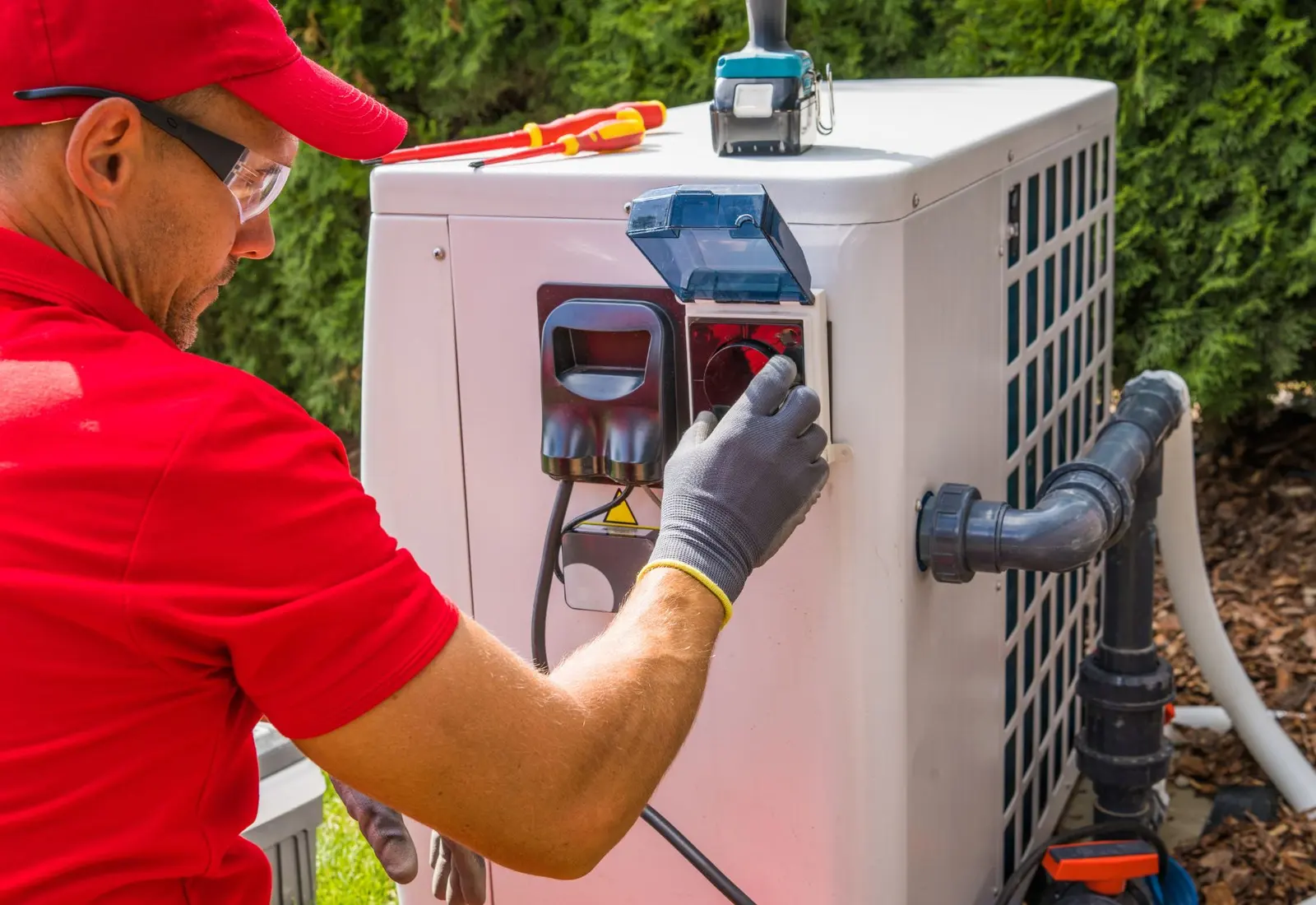 A GV's technician servicing an outdoor unit